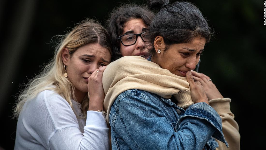 Women weep as they comfort each other during a vigil near the Masjid Al Noor mosque in Christchurch, New Zealand, on Monday, March 18.