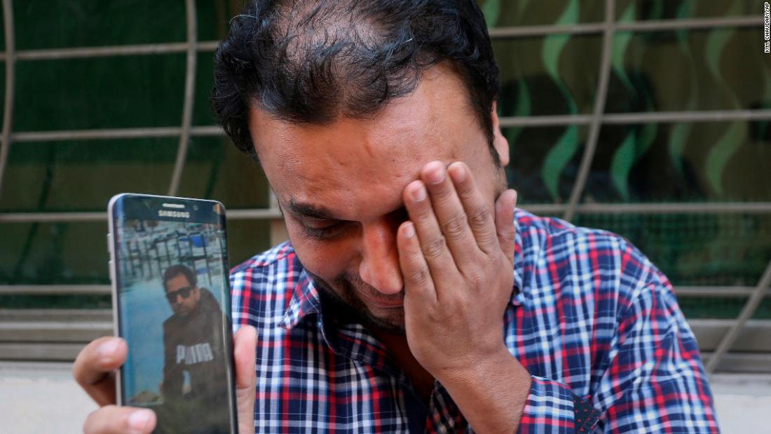 A relative weeps while showing the picture of Sohail Shahid, a Pakistani citizen who was killed in the Christchurch mosque shootings, on his cell phone outside his home in Lahore, Pakistan, Sunday, March 17. Pakistan&#39;s foreign ministry spokesman says three more Pakistanis have been identified among the dead, increasing the number of Pakistanis to nine killed in the mass shootings at two mosques in the New Zealand city of Christchurch.