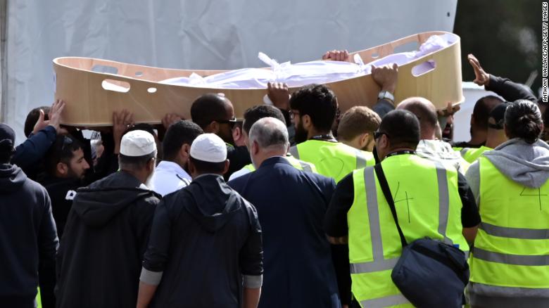 Mourners carry the coffin of a victim killed in the attack.