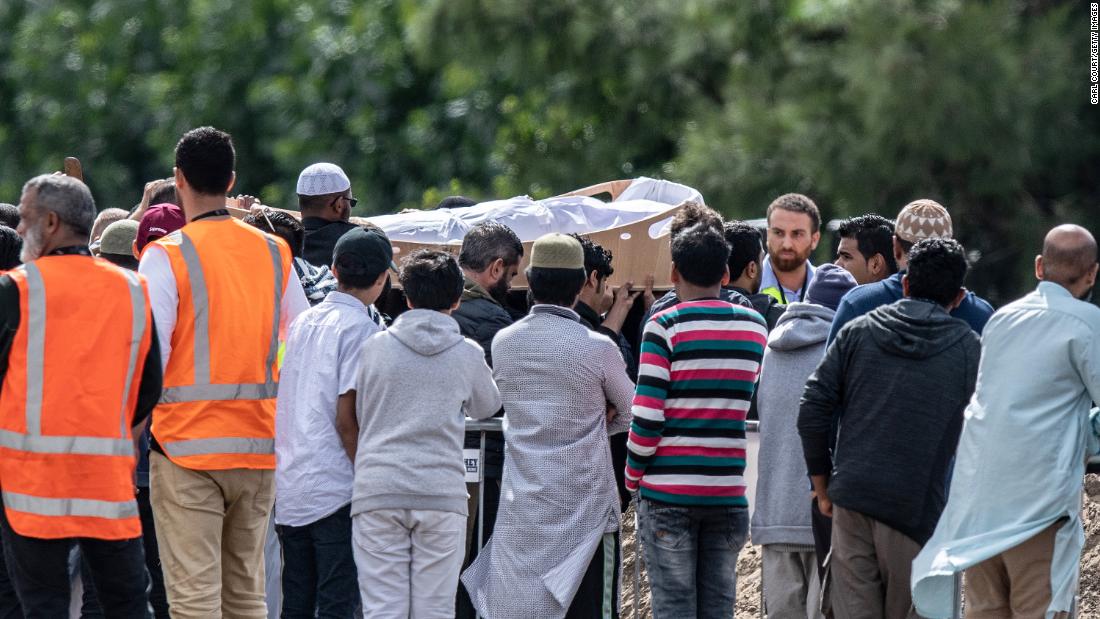 Mourners carry the coffin of a shooting victim during a funeral at the Memorial Park Cemetery in Christchurch on Wednesday, March 20. Hundreds of mourners gathered for the first funerals of those killed as New Zealanders braced for days of emotional farewells.