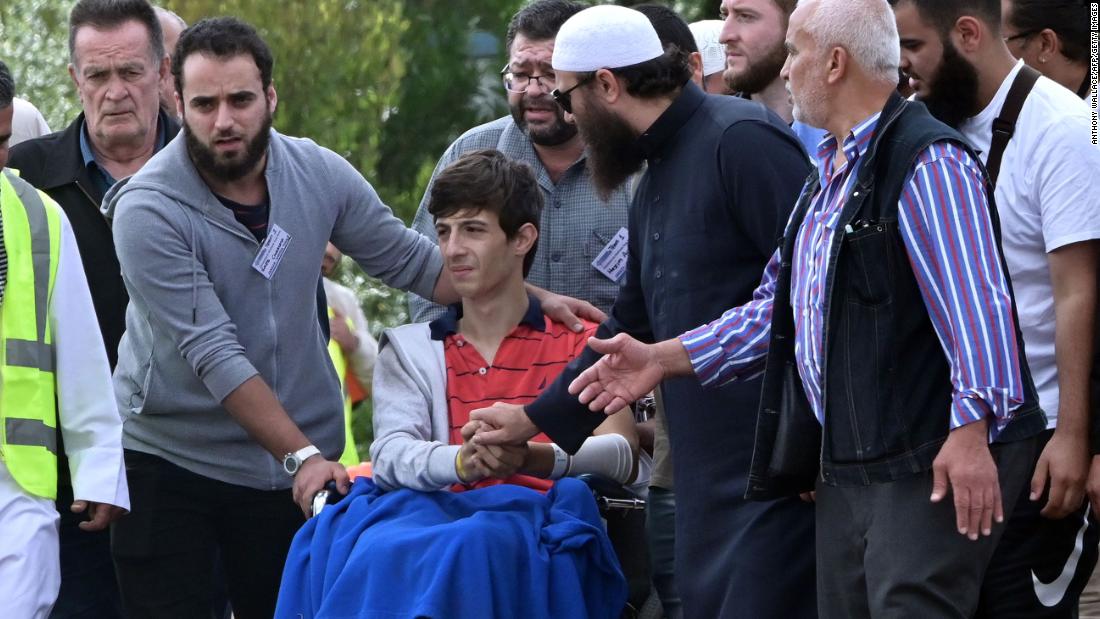 Zaid Mustafa (in wheelchair), who was wounded in the attack on two mosques in Christchurch, New Zealand, &lt;a href=&quot;https://www.cnn.com/2019/03/20/australia/new-zealand-victims-funerals-christchurch-intl/index.html&quot; target=&quot;_blank&quot;&gt;attends the funeral&lt;/a&gt; of his slain father, Khalid Mustafa and brother Hamza Mustafa at the Memorial Park Cemetery in Christchurch on March 20.