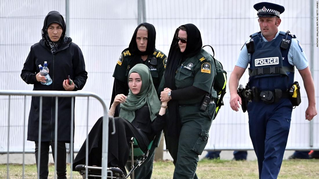 A mourner in a wheelchair leaves Memorial Park Cemetery on March 20 after attending a funeral for victims killed in the mosque massacre in Christchurch, New Zealand. A Syrian refugee and his son were buried in the first funerals for those killed in the attack as New Zealanders braced for days of emotional farewells following the mass slayings.