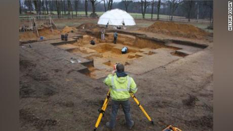 Tents with heaters are used to thaw frozen ground before archaeologists can begin excavation.