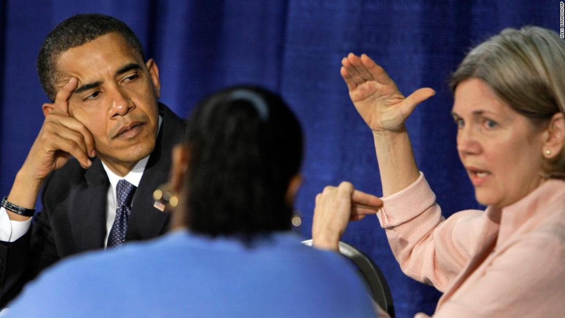 US Sen. Barack Obama listens to Warren speak during a roundtable discussion about predatory lending in 2008. Warren is an expert on bankruptcy law and was an adviser to the National Bankruptcy Review Commission in the 1990s. In 1989, Warren co-authored the book &quot;As We Forgive Our Debtors: Bankruptcy and Consumer Credit in America.&quot;