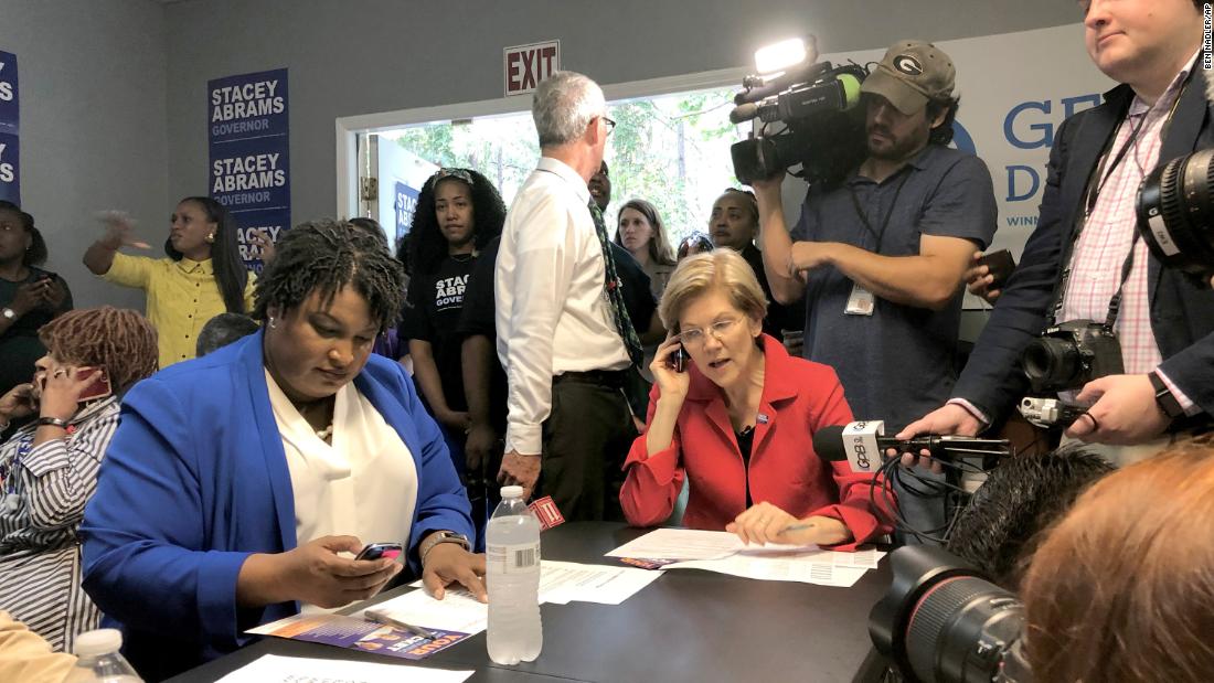 Warren helps Georgia gubernatorial candidate Stacey Abrams make calls to voters in October 2018.