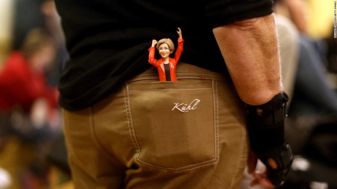 A Warren figurine sits in the back pocket of Mary Jo Kane during a town-hall event in Boston in October 2018.