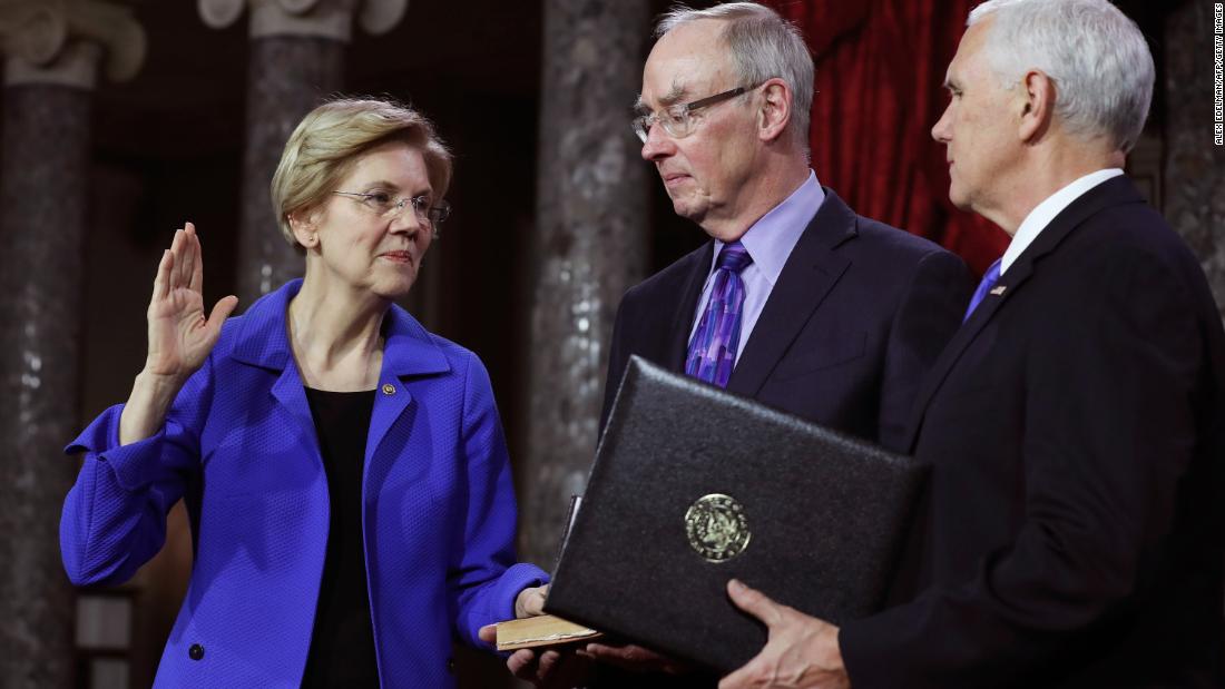 Warren was re-elected in 2018. Here, she is joined by her husband, Bruce Mann, as Vice President Mike Pence re-enacts her swearing-in. 