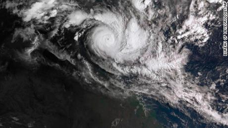 In a satellite image acquired from the Australian Bureau of Meteorology, Cyclone Trevor moves over Australia&#39;s Northern Territory on Tuesday.