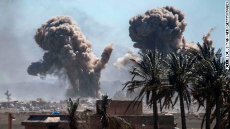 Smoke rises above Baghouz during the final battle to retake the town.