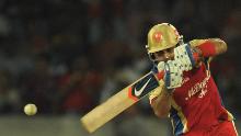 Royal Challengers Bangalore batsman Virat Kohli plays a shot during the IPL Twenty20 cricket match between Deccan Chargers and Royal Challengers Bangalore at Rajiv Gandhi International Stadium in Hyderabad on May 20, 2012.  RESTRICTED TO EDITORIAL USE. MOBILE USE WITHIN NEWS PACKAGE AFP PHOTO/Noah SEELAM        (Photo credit should read NOAH SEELAM/AFP/GettyImages)