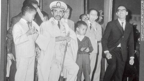 Emperor Haile Selassie and his grandchildren waiting for an Ethiopian Airlines jet. 