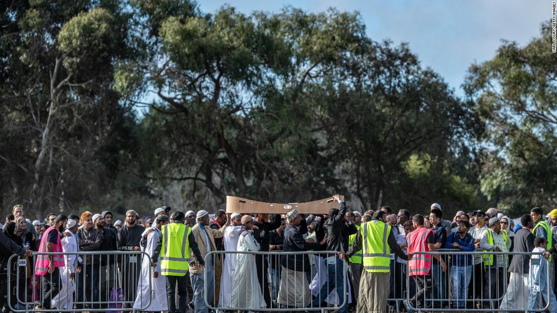  A coffin containing the body of a victim of the Christchurch mosque attacks is carried for burial at Memorial Park Cemetery on Friday in Christchurch, New Zealand. 