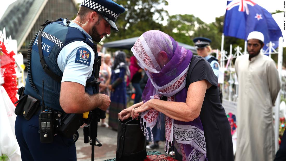 Police inspect bags of the guests arriving at the Ponsonby Masjid Mosque during an open service to all religions Friday in Auckland, New Zealand. 