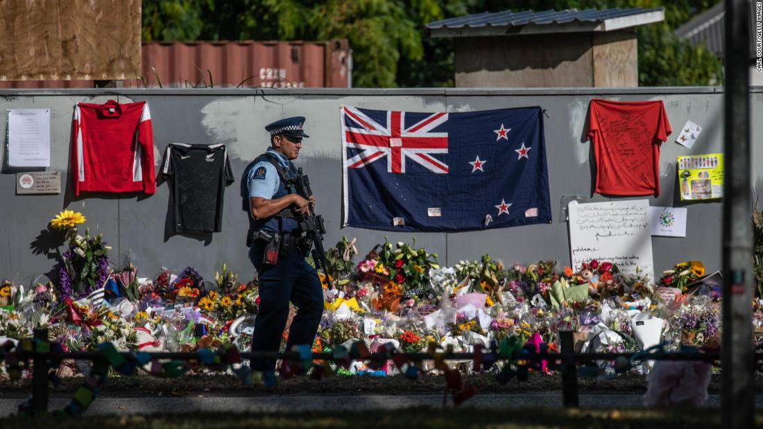 An armed police officer patrols near Al Noor mosque in Christchurch. 