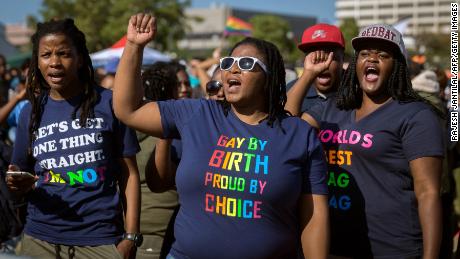 Members of the South African Lesbian, Gay, Bisexual and Transgender and Intersex (LGBTI) community chant slogans as they take part in the annual Gay Pride Parade, as part of the three-day Durban Pride Festival, on June 24, 2017 in Durban. / AFP PHOTO / RAJESH JANTILAL        (Photo credit should read RAJESH JANTILAL/AFP/Getty Images)