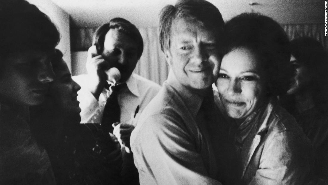 Carter embraces his wife after receiving news of his election victory on November 2, 1976. Carter received 297 electoral votes, while Ford received 241.