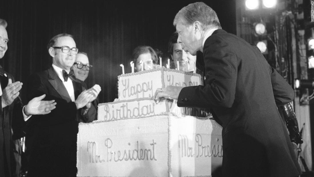 Three days before his birthday in 1978, Carter blows out candles on a birthday cake presented to him at a fundraiser for the Democratic National Committee.