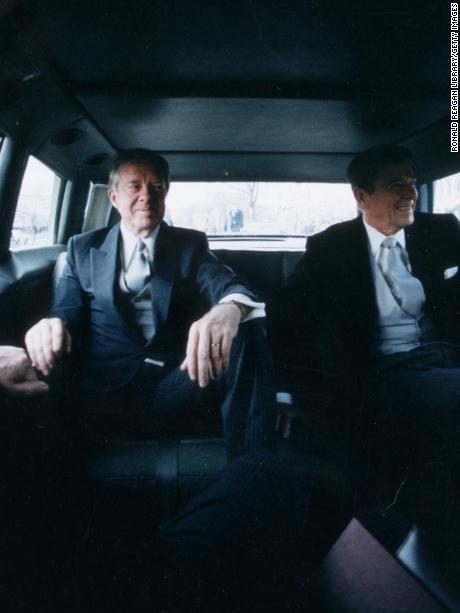 20th January 1981:  Outgoing US President Jimmy Carter (L) sits with president-elect Ronald Reagan in the back of a limousine en route to Reagan&#39;s Presidential Inauguration Ceremony, Washington, DC.  (Photo by Ronald Reagan Library/Getty Images)
