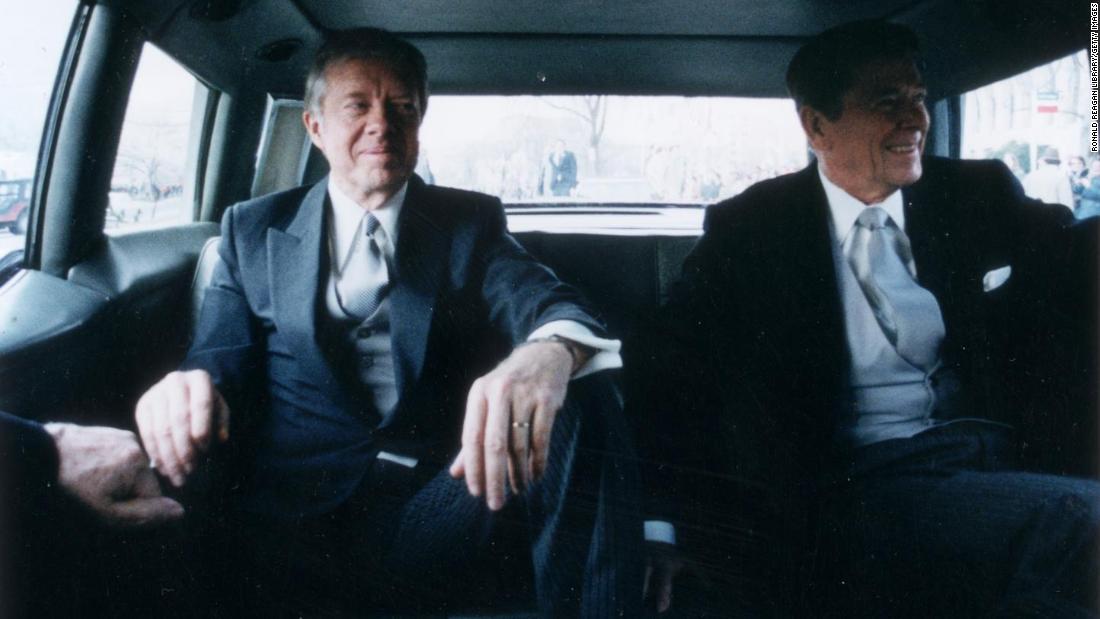 Outgoing President Carter, left, sits with President-elect Ronald Reagan en route to Reagan&#39;s inauguration in January 1981.