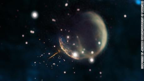 The CTB 1 supernova remnant resembles a ghostly bubble and the glowing trail is the pulsar.