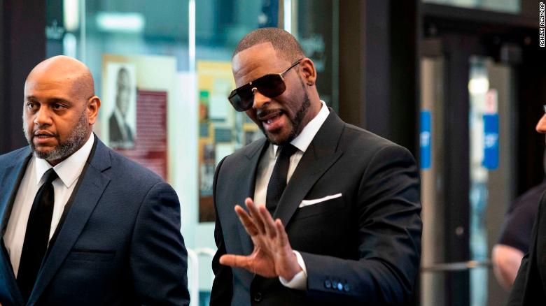 R. Kelly walks into the courthouse in Chicago on Friday morning ahead of his hearing.