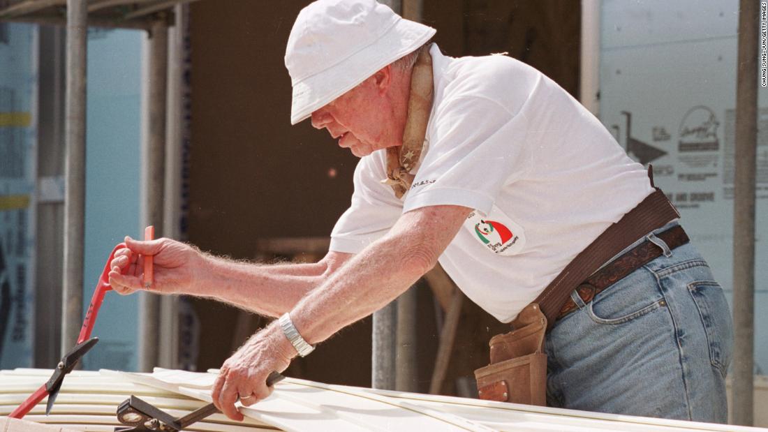 Carter works at a construction site sponsored by the Jimmy Carter Work Project in Asan, South Korea, on August 6, 2001. The Carters have been involved with the nonprofit Habitat for Humanity since 1984.