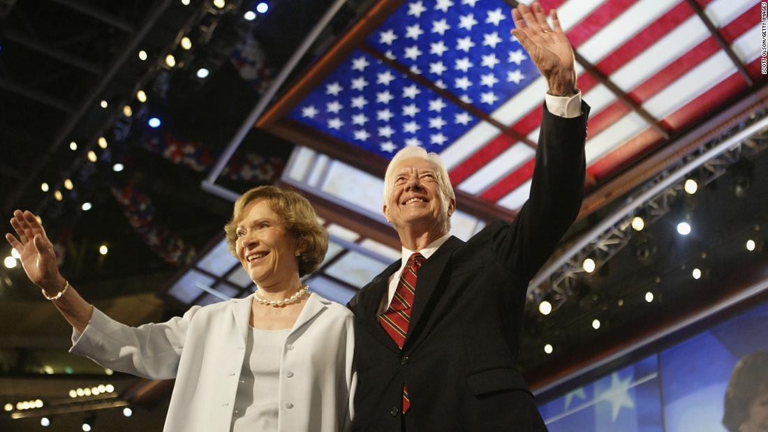 The Carters wave to the audience at the Democratic National Convention in Boston in 2004.