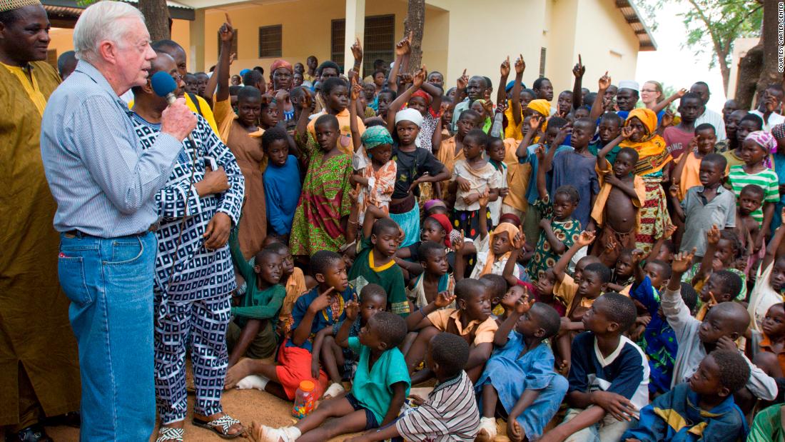 In February 2007, Carter speaks to children in Ghana on the seriousness of eradicating guinea worm disease.