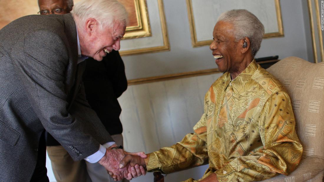 Carter greets South African leader Nelson Mandela in Johannesburg in May 2010.