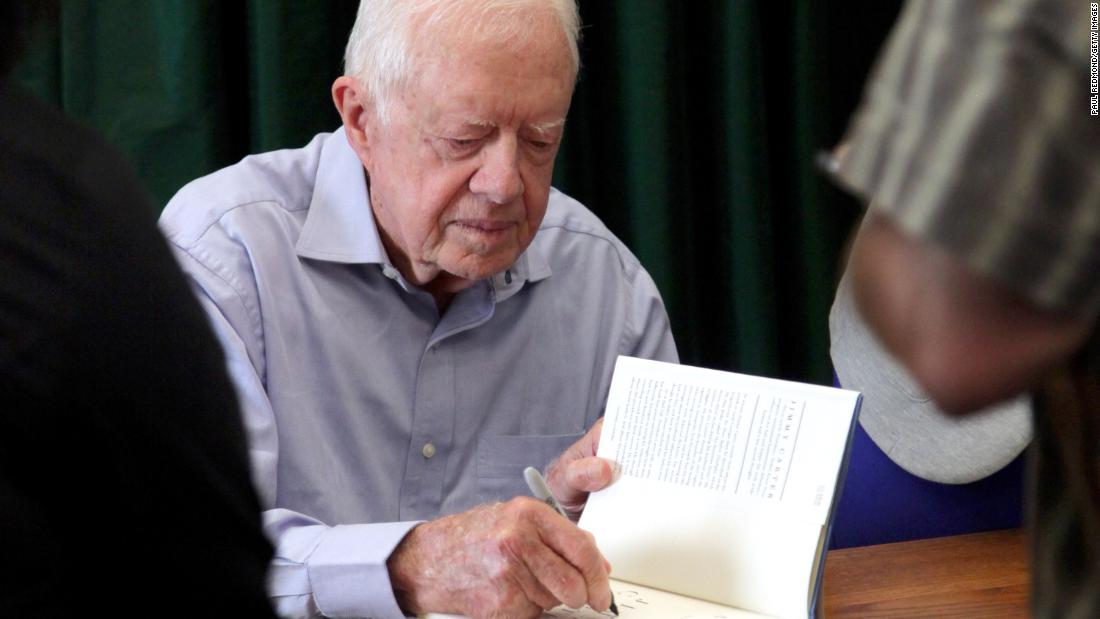 Carter signs his book &quot;A Full Life: Reflections At Ninety&quot; in Pasadena, California, in July 2015.