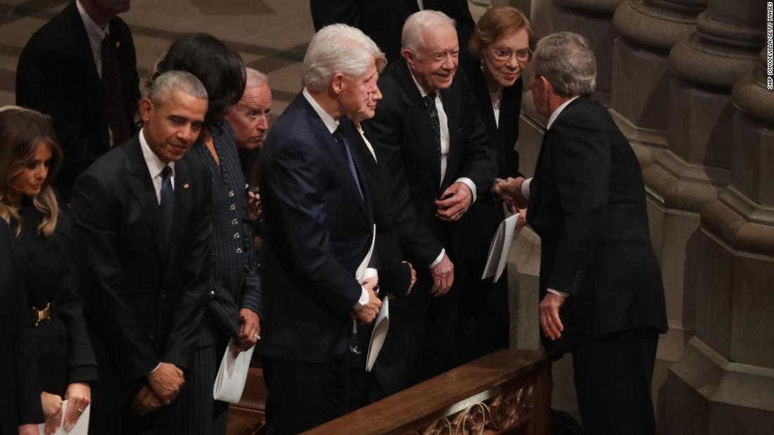Former US President George W. Bush greets Carter and other former presidents during the state funeral for his father in December 2018.