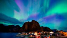 Northern lights (aurora borealis) illuminate the sky over Reinfjorden in Reine, on Lofoten Islands, Arctic Circle, on September 8, 2017. / AFP PHOTO / Jonathan NACKSTRAND        (Photo credit should read JONATHAN NACKSTRAND/AFP/Getty Images)