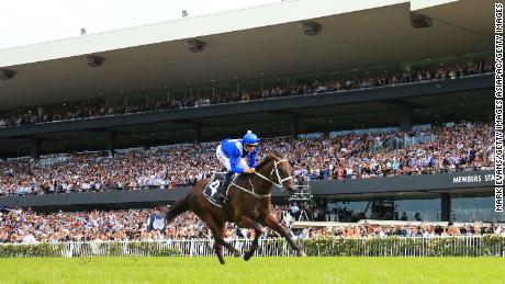 Winx and Hugh Bowman run clear at Rosehill.