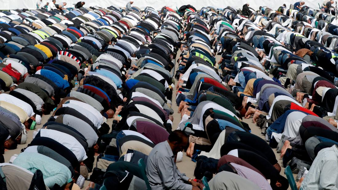 Muslims pray during Friday prayers at Hagley Park in Christchurch on March 22.