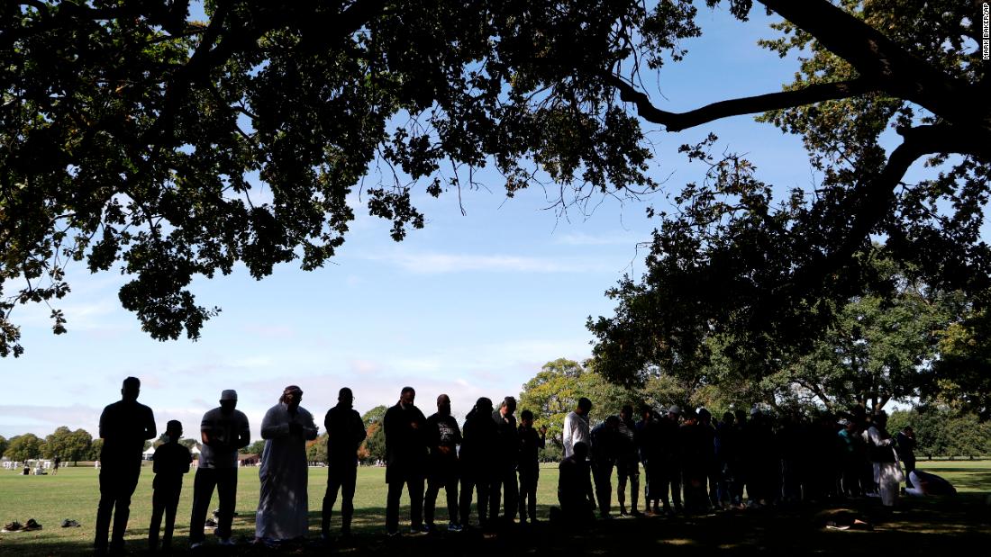 Muslim men pray in Hagley Park near Al Noor mosque in Christchurch, New Zealand, on Saturday, March 23. Most of the victims in the terror attacks died at that mosque.