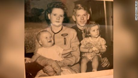 Betty and Lynn Hadfield hold their children, Kent, 3 months, and Mary Ann, 2, in 1944.