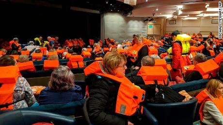 This photo provided by Michal Stewart shows passengers on board the Viking Sky, waiting to be evacuated, off the coast of Norway on Saturday, March 23, 2019. Rescue workers off Norway's western coast rushed to evacuate 1,300 passengers and crew from the disabled cruise ship by helicopter on Saturday, winching them one-by-one to safety as heaving waves tossed the ship from side to side and high winds battered the operation. (Michal Stewart via AP)