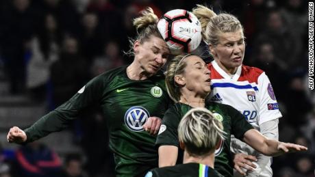 Hegerberg (R) heads the ball in a Champions League quarterfinal match against Wolfsberg. 