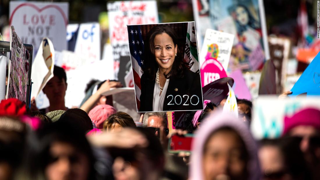 A person holds a Harris poster during the Women&#39;s March in Los Angeles in January 2019.