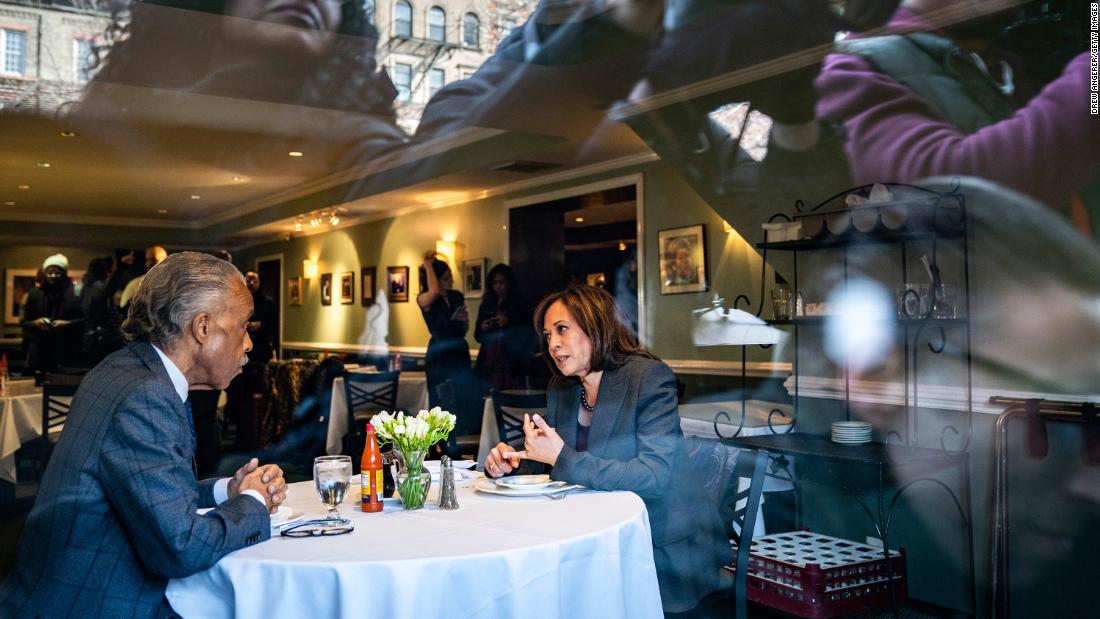 Media members photograph Harris and the Rev. Al Sharpton as they have lunch at Sylvia&#39;s Restaurant in New York in February 2019.