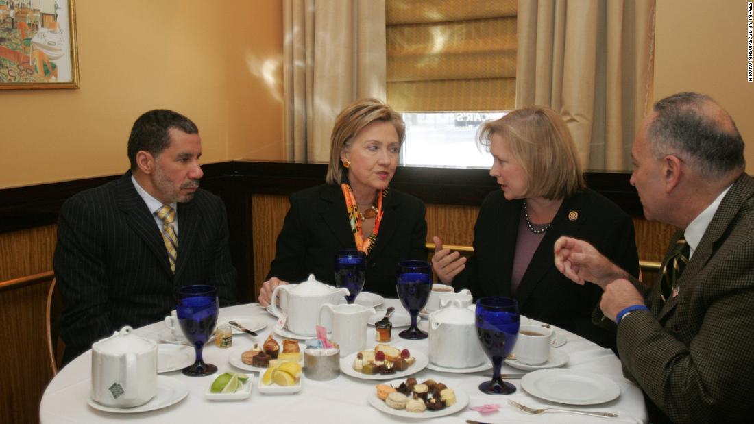 Gillibrand talks with Hillary Clinton during a lunch meeting that included New York Gov. David Paterson, left, and US Sen. Chuck Schumer in January 2009. Paterson appointed Gillibrand to replace Clinton as US senator. Gillibrand later won a special primary election in 2010 and was re-elected in 2012.