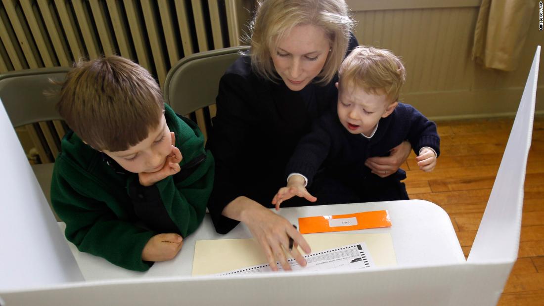 Gillibrand votes with her sons Theo, left, and Henry in November 2010.