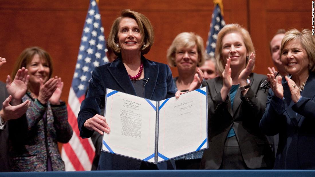 Gillibrand joins House Speaker Nancy Pelosi during the signing of the bill that repealed the US military&#39;s &quot;don&#39;t ask, don&#39;t tell&quot; policy in December 2010.