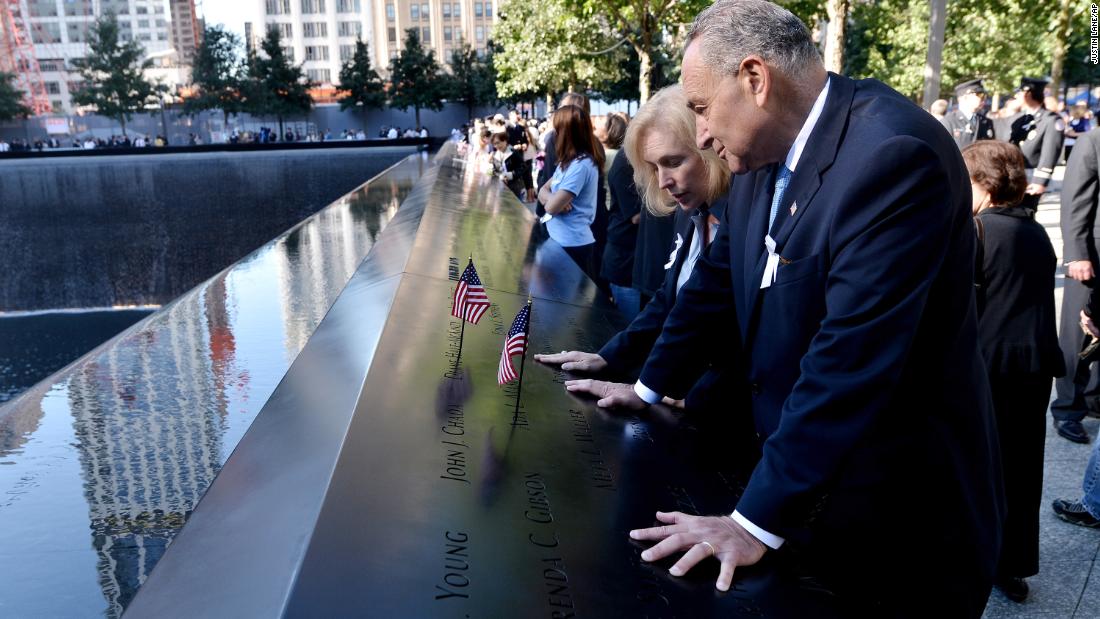 Gillibrand and Schumer place American flags at the reflecting pools of the World Trade Center Memorial in 2012.