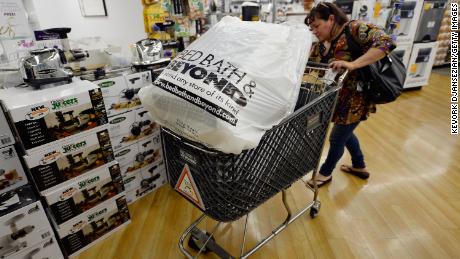 LOS ANGELES, CA - APRIL 10:  Customers carry bags from  Bed Bath &amp; Beyond store on April 10, 2013 in Los Angeles, California. The home goods retailer is expected to release fourth-quarter earnings figures after the closing bell.  (Photo by Kevork Djansezian/Getty Images)