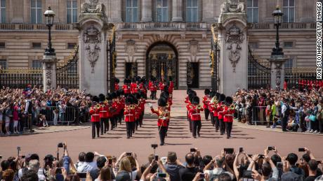 Tourists watch the Changing of the Guard at Buckingham Palace in 2015. 