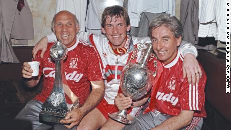 Liverpool player-manager Kenny Dalglish, center, on his final appearance as a player, Ronnie Moran, left, and Roy Evans celebrate the 1990 Division One Championship.