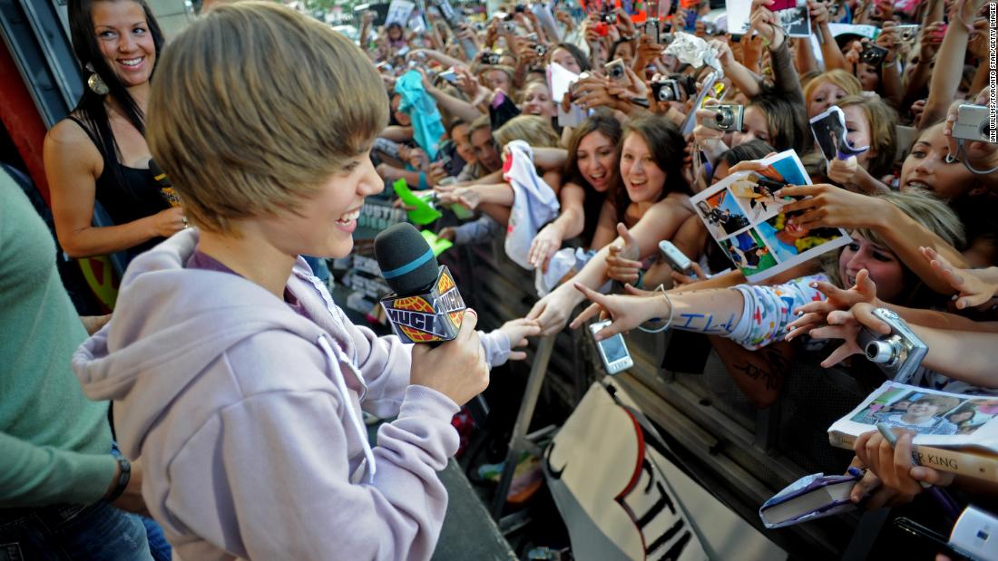 Bieber greets fans in Toronto in August 2009. His first single, &quot;One Time,&quot; came out a couple months earlier and went platinum. He followed that up with his debut EP, &quot;My World,&quot; in November 2009. It also went platinum.