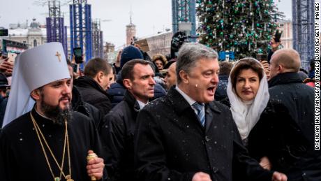 KIEV, UKRAINE - JANUARY 07: Metropolitan Epiphanius of Kiev and All Ukraine (L), with Ukrainian President Petro Poroshenko (C) on Sofiyivska Square following Christmas liturgy at St. Sophia&#39;s Cathedral on January 07, 2019 in Kiev, Ukraine. The independent Orthodox Church of Ukraine, which previously fell under the authority of Moscow, was granted official recognition yesterday in a decree, or &quot;tomos,&quot; signed yesterday in Istanbul by the Ecumenical Patriarch of Constantinople Bartholomew I in a move with deep historical roots but fueled by contemporary political conflict between Ukraine and Russia. (Photo by Brendan Hoffman/Getty Images)