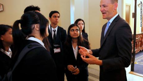 Assemblyman Kevin McCarty, D-Sacramento, right, talks with a group of high school students after his news conference concerning a proposed package of bills dealing with the recent college admissions scandal, Thursday, March 28, 2019, in Sacramento, Calif. McCarty, and other Democratic lawmakers unveiled a half-dozen measures that would require that three college administrators sign off on special admissions and a ban upon preferential admissions for students related to the institution&#39;s donors of alumni. (AP Photo/Rich Pedroncelli)